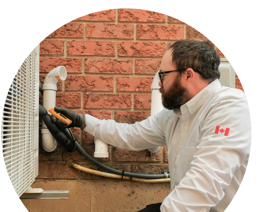 Wardlaw HVAC specialist checking insulated piping on a heat pump unit beside a brick wall during a diagnostic service. Wardlaw HVAC specialist checking insulated piping on a heat pump unit beside a brick wall during a diagnostic service.